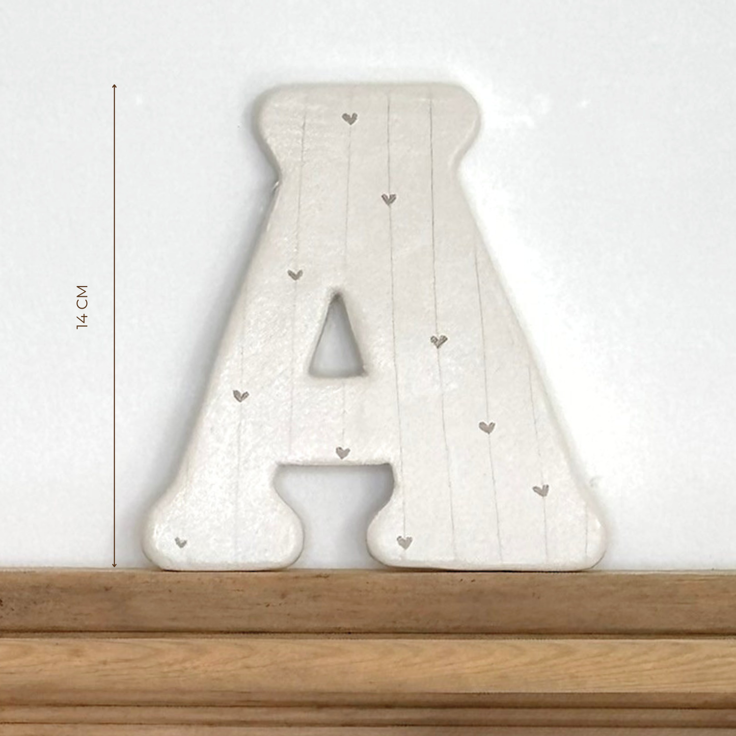 Lettre initiale sur cordon